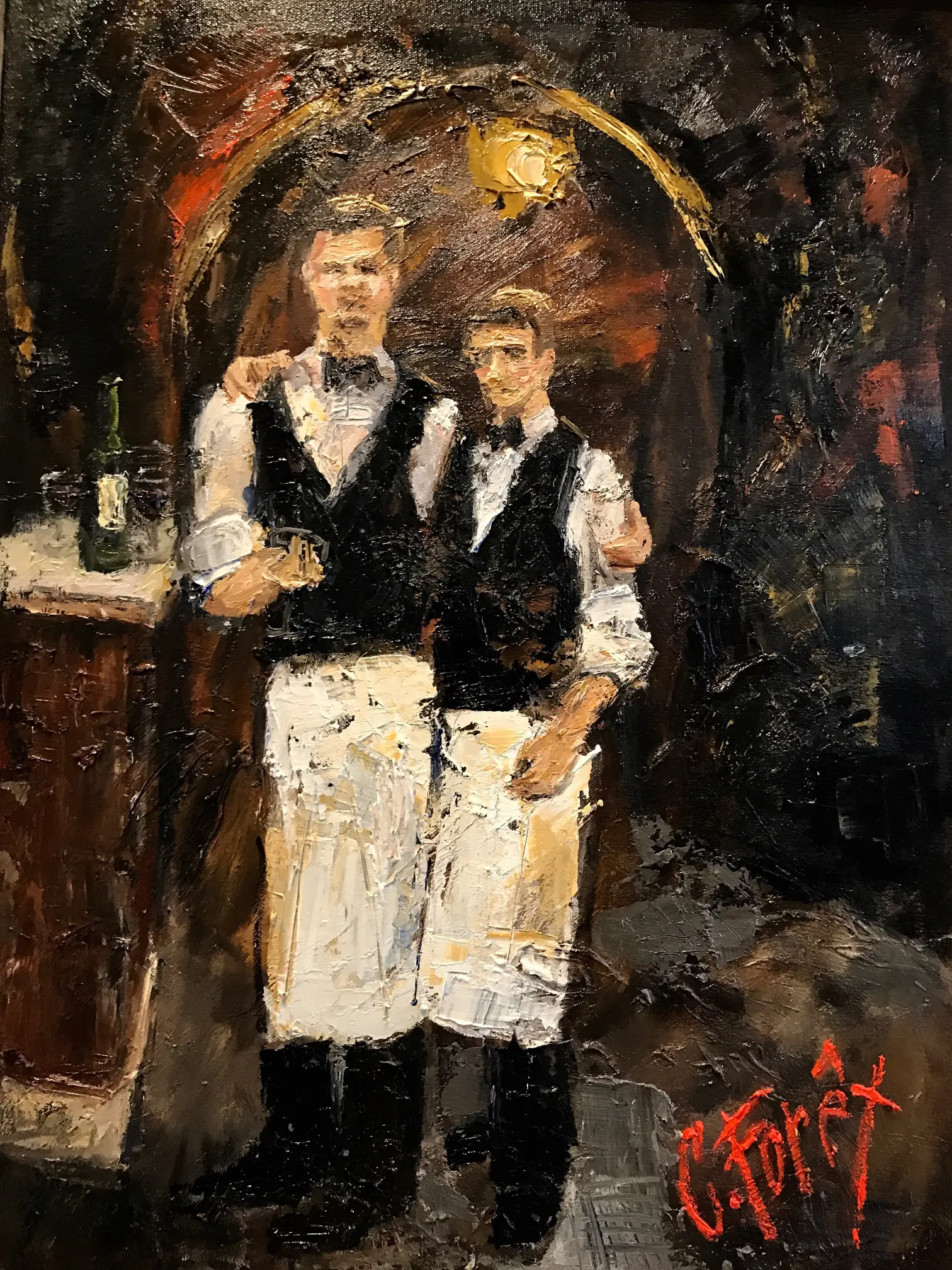 Two men in white aprons standing next to a bar.